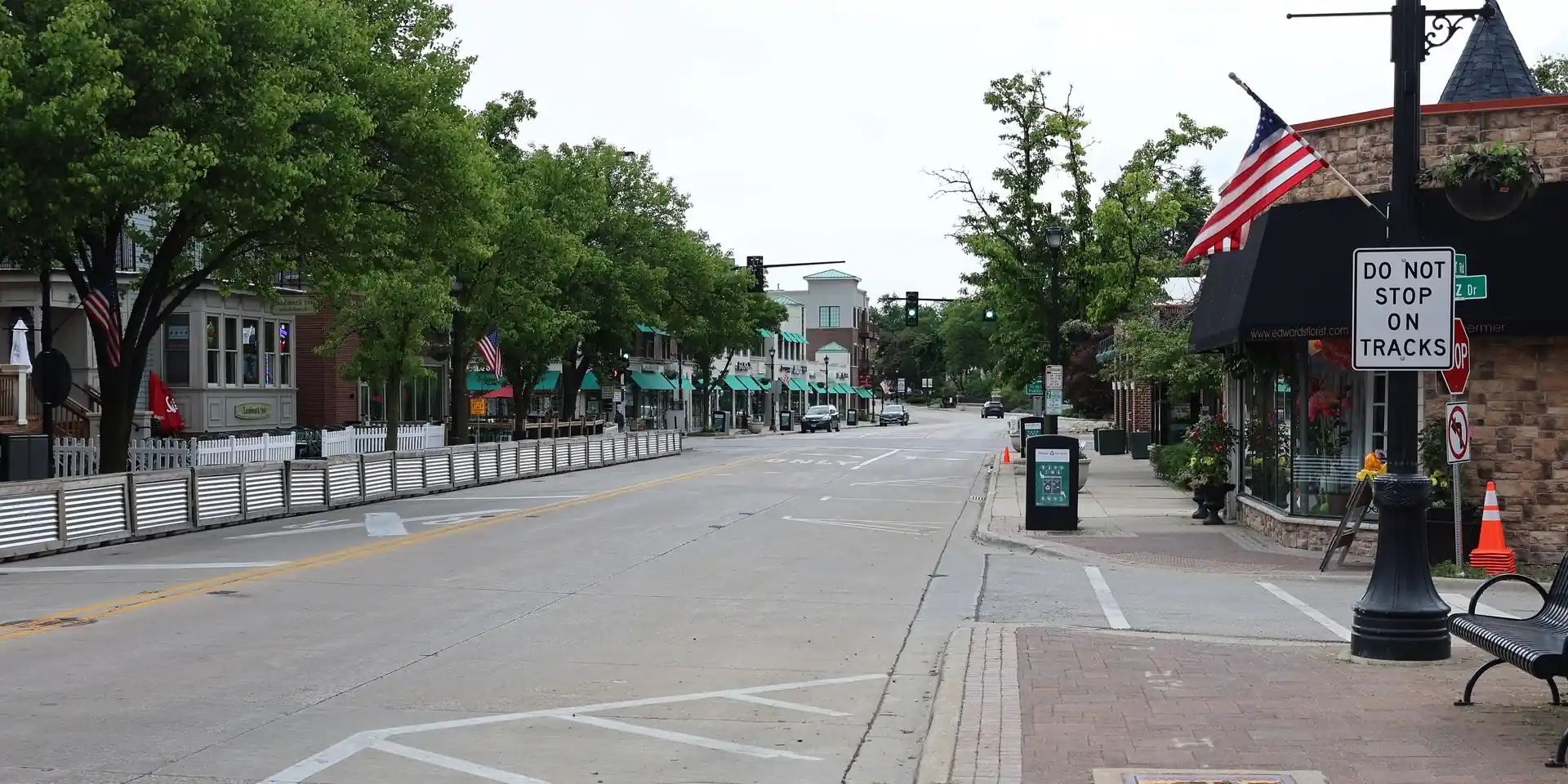 Tree-lined street and storefronts in downtown Northbrook, IL